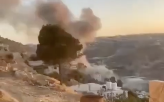 Smoke rises from the reported point of impact of a Houthi missile in Sa'ir, a Palestinian town near Hebron in the southern West Bank, June 14, 2025. (Screen capture: Shehab News Agency)